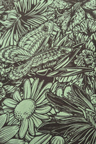 Bloom print of flowers, butterflies and dragon flies in olive and green on cotton stretch material