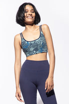 Model wearing a Light Blue with Navy Nagomi print cross back bra with our Navy High waist flares, shown from the front. Nagomi is a japanese inspired print