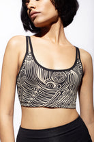 Model wearing our Cream Black Tribal printed cross back bra shown from the front