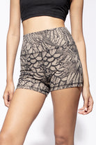 Model wearing cream black feather shorts with high waist, shown from the front close up funky simplicity