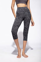 Woman wearing grey black feather printed capri leggings made from cotton lycra shown from the front - funky simplicity