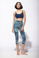 Woman wearing Nagomi Capri leggings with a Navy Cross back bra from Funky Simplicity - shown from the front