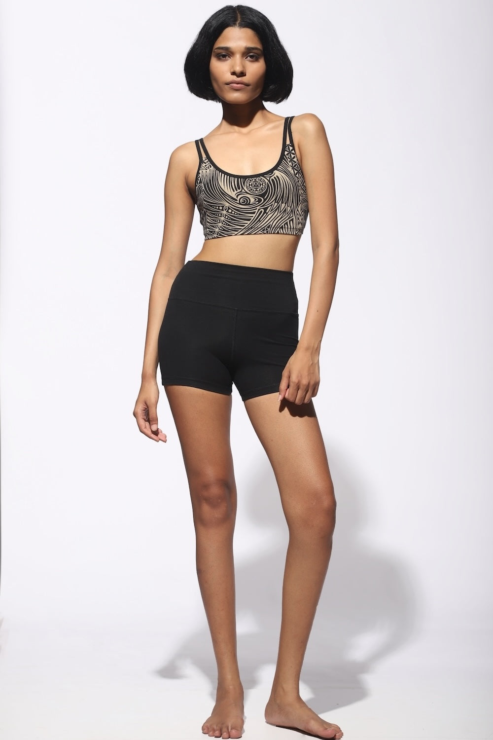 Our model is wearing High Waist Shorts black from front with cream black tribal cross-back bra from Funky Simplicity